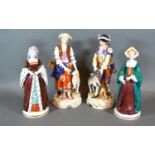 A Pair of German Porcelain Figures decorated in polychrome enamels and highlighted with gilt