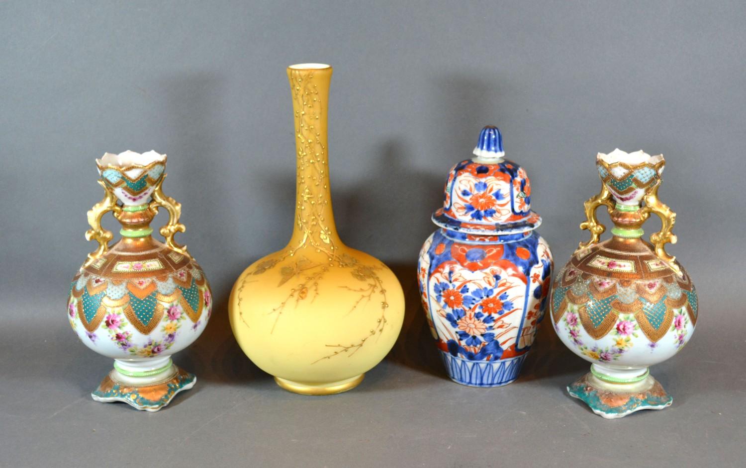 A Pair of Victorian Porcelain Two Handled Vases together with a covered Imari vase and a Victorian