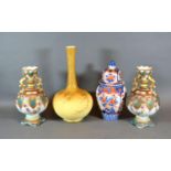 A Pair of Victorian Porcelain Two Handled Vases together with a covered Imari vase and a Victorian