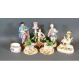 A 19th Century Porcelain Candlestick of figural form, gold anchor mark, 18 cms tall, together with