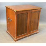 A 19th Century Collectors Cabinet, the moulded top above two panel doors enclosing sliding trays