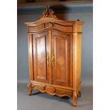 A French Kingwood Table Cabinet in the form of an Armoire, the scroll carved cresting and moulded