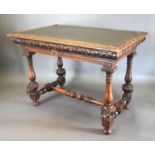 A Victorian Carved Oak Library Table, the leather inset top above a frieze drawer with brass handle,