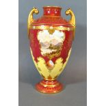 A Coalport Porcelain Two Handled Vase hand painted with a reserve upon a red and cream ground