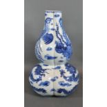 A 19th Century Chinese Porcelain Gourd Vase of Triform decorated in underglaze blue with serpents,