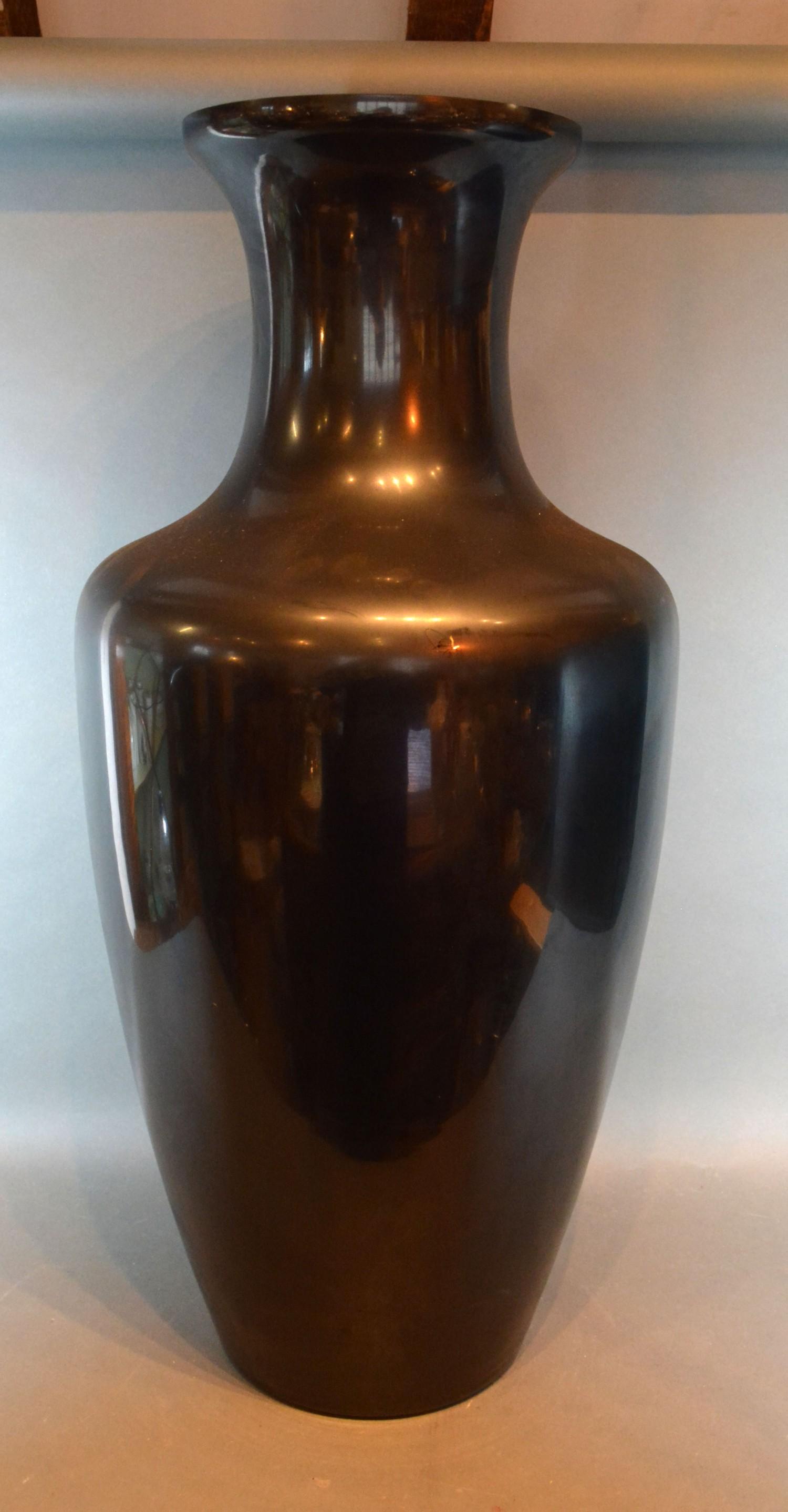 A Black Glass Floor Vase of Oviform 77 cms tall