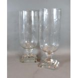 A Pair of Cut Glass Storm Lamps with star cut decoration, 40 cms tall