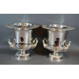 A Pair of Silver Plated Wine Coolers with side handles and circular pedestal bases and with inner