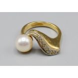 A Yellow Metal Dress Ring, set with a band of diamonds and single pearl, 5.8 grams, ring size K