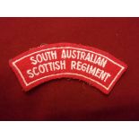 Australian South Australian Scottish Regiment cloth shoulder title, white on red