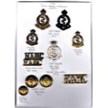 Royal Army Medical Corps Badge Collection on a sheet, Two KC and one QC Cap Badges (Brass, Bronzed-