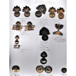 The Royal Fusiliers Collection on a sheet including: K&K: 597 WWI Cap Badge with two sets of