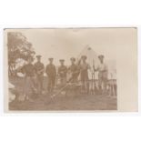 Military Postcard depicting Soldiers of the 1st Batt The Rifle Brigade holding brooms and spades