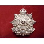 The Border Regiment WWI Forage Cap Badge (White-metal with red cloth backing), two lugs, this