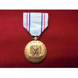 United States of America Vietnam War era Air Force Good Conduct Medal, maker on clasp 'E101'