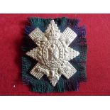 Black Watch (Royal Highlanders) WWI Cap Badge (White-metal with tartan backing), two lugs. K&K: