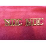 National Defence Corps WWII Officers Cap Badge (Gilding-metal), slider, with solid centre. K&K: