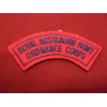 Australian Royal Army Ordnance Corps cloth shoulder title, blue on red