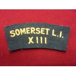 British XIII Somerset Light Infantry cloth shoulder title, yellow on green backing
