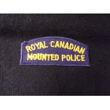 Royal Canadian Mounted Police Cloth Shoulder Title (yellow thread on blue backing)