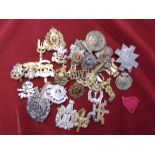 Mixed batch of cap badges, shoulder titles etc some A/F, useful lot, 35 approx.