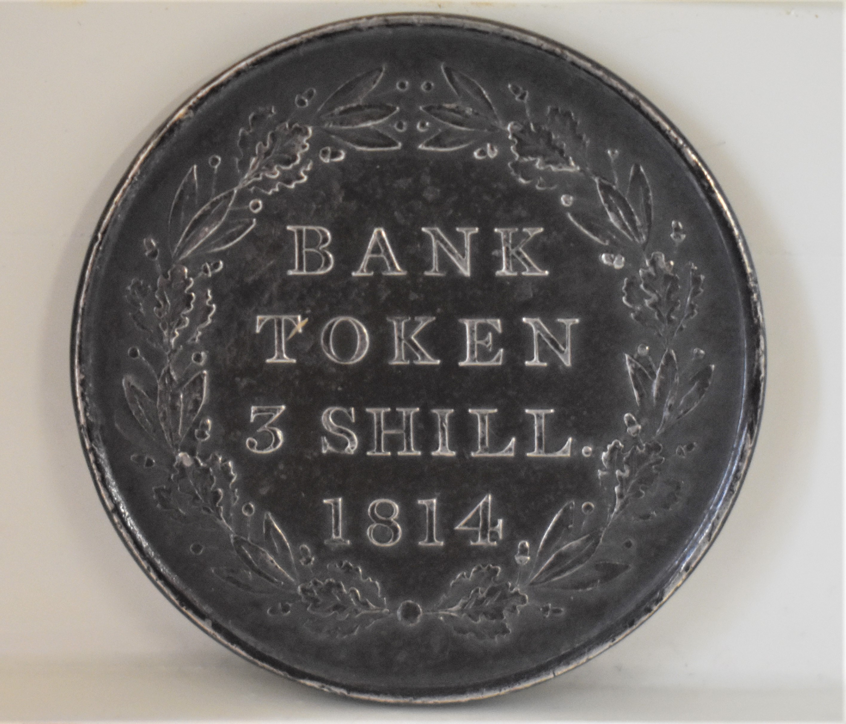 1814 Three Shillings Token, GVF dark toning. Spink 3770 - Image 2 of 2