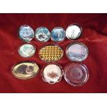 A collection of ten Paperweights, some interesting designs with photographs, a dried flower by J.
