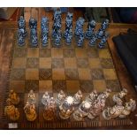 Large animal kingdom moulded chess set. Complete with carved style playing base. Used condition