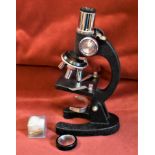 Small microscope for a child inside wooden box. Good lens and refracting lens