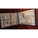 Cigarette & Trade Cards. Assorted collection in an album in plastics including silks (small)
