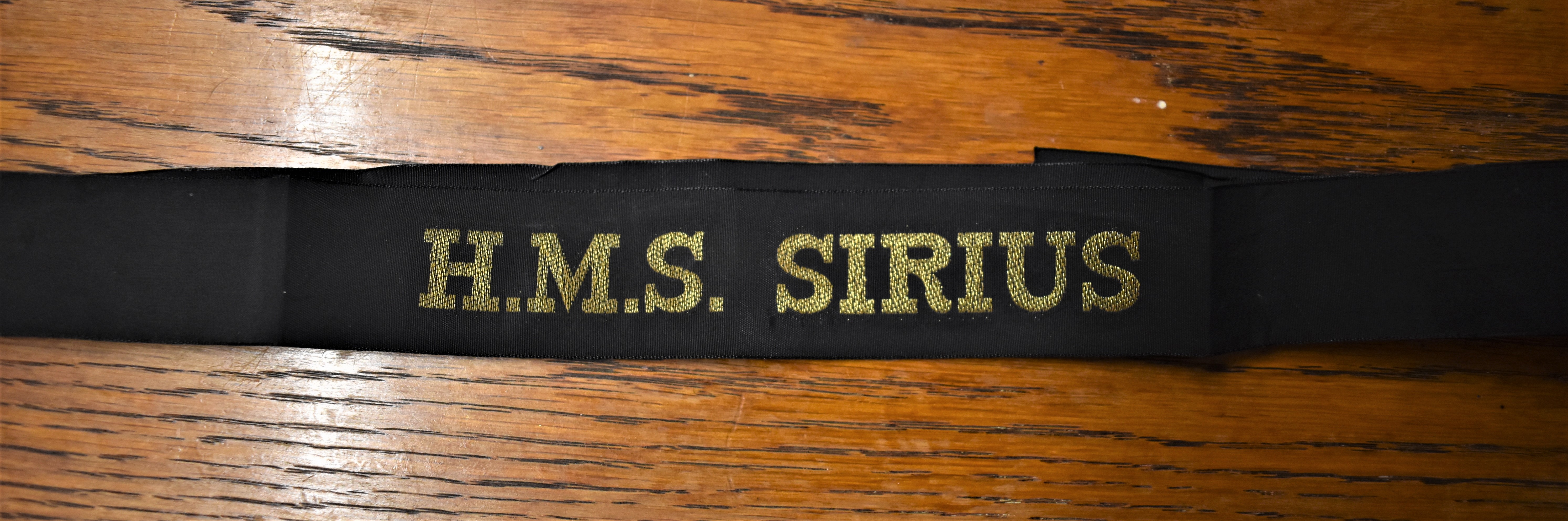 H.M.S. SIRIUS British Naval Cap Tally:- H.M.S. Sirius was a Dido-class light cruiser of the Royal