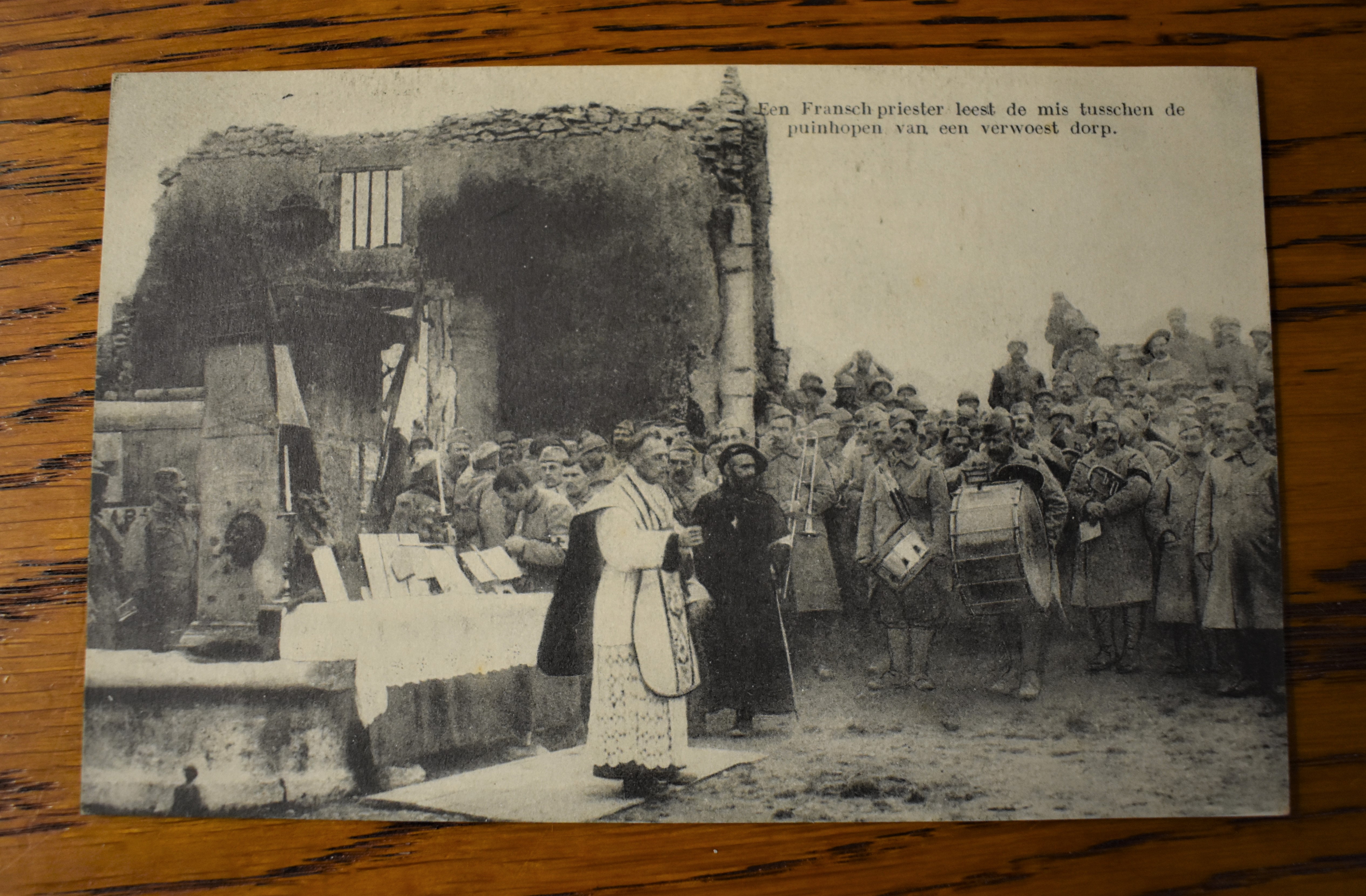 French WWI RP Postcard of a French Priest giving Communion to the Soldiers in the ruins of a Church.