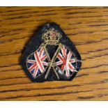 British WWI Patriotic Sweetheart Badge, the deign of two Union Flags with gold braid with a KC
