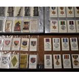 Military Cigarette cards in plastics as an album. Sets, partial sets, some rare cards and some