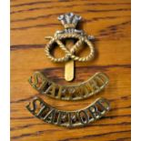 Staffordshire Regiment (Prince of Wales's) Cap Badge and pair of Shoulder Titles. K&K: 2050 worn