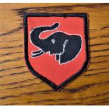 Rhodesian Army 1st Brigade Shoulder Patch, in the design of an elephant on red backing.