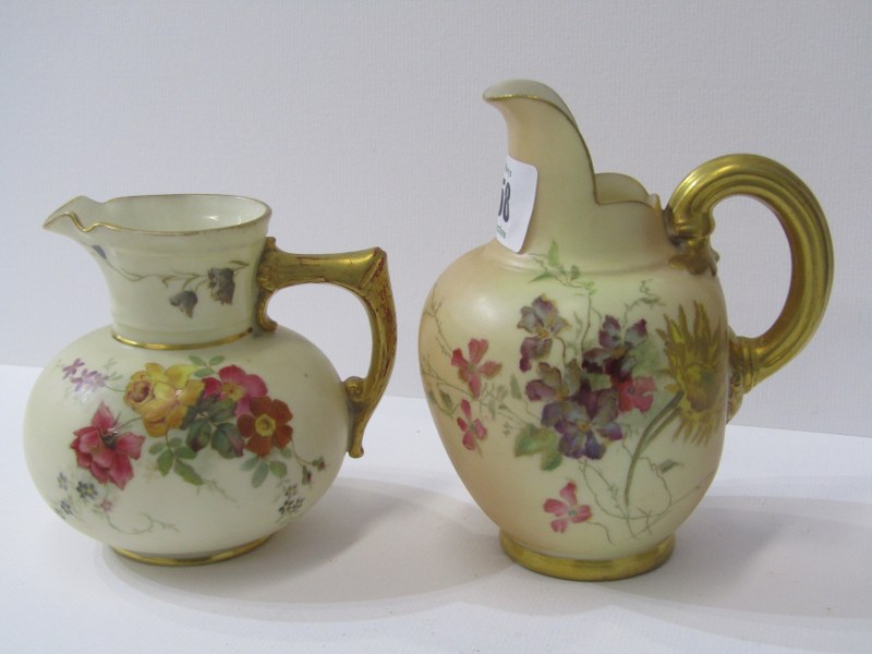 ROYAL WORCESTER, 2 gilt handled floral decorated cream jugs