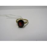 9CT YELLOW GOLD GARNET SOLITAIRE RING, principle oval cut garnet stone weighing in excess of 1.