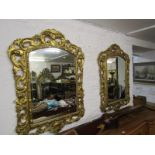 ANTIQUE MIRRORS, pair of 19th Century carved gilt wood foliate surround bevelled glass mirrors,
