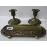 METALWARE, Edwardian brass and copper 3 piece desk set of pen tray and pair of dwarf candlesticks