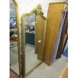 GILT HALL MIRROR, bevelled glass serpentine crested hall mirror, 68" height 31" width