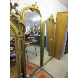 GILT HALL MIRROR, foliate crested narrow gilt framed hall mirror, 73" height 24" width