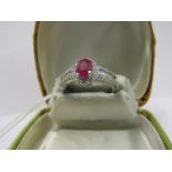 PLATINUM RUBY & DIAMOND RING, by Rhapsody, principle oval cut Burmese ruby of approximately 0.75ct