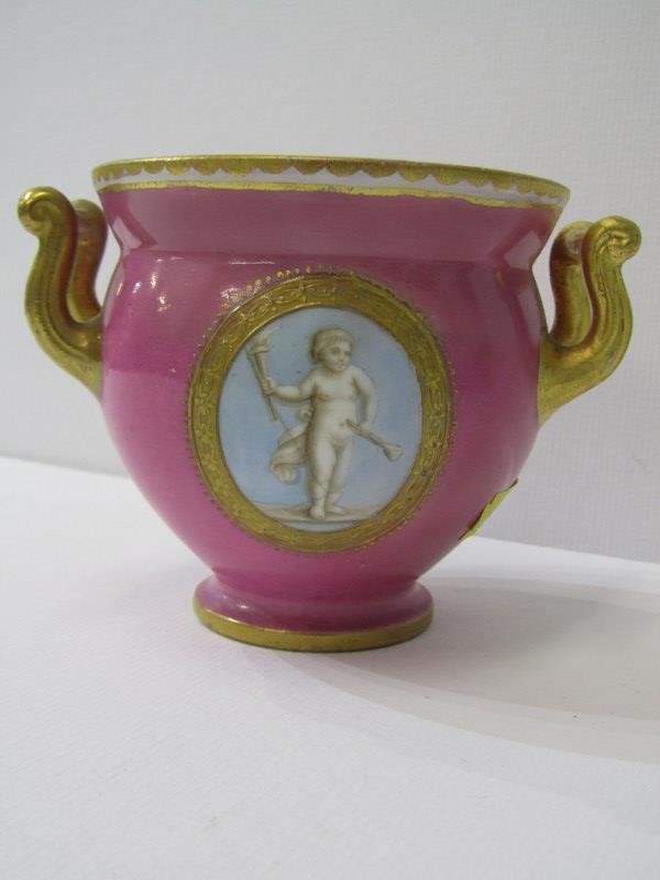 COALPORT, a gilt twin handled pink ground table pot, gilt ampersand mark (restored)