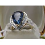 18ct WHITE GOLD TANZANITE & DIAMOND RING, principal pear cut tanzanite in excess of 5cts