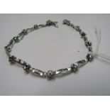 18ct WHITE GOLD DIAMOND BRACELET, heavy 18ct white gold set with 14 floral diamond clusters, total