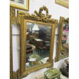 GILT WALL MIRROR, floral wreath and emblem crested rectangular wall mirror, 39" x 26"