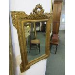 GILT WALL MIRROR, bevelled glass floral garland crested hall mirror, 34" height 24" width