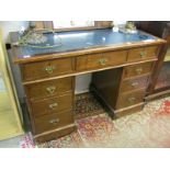 EDWARDIAN KNEEHOLE DESK, mahogany twin pedestal kneehole desk of 9 graduated drawers (requires