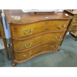 CONTINENTAL WALNUT COMMODE, cross banded walnut triple drawer chest, with gilt brass foliate handles